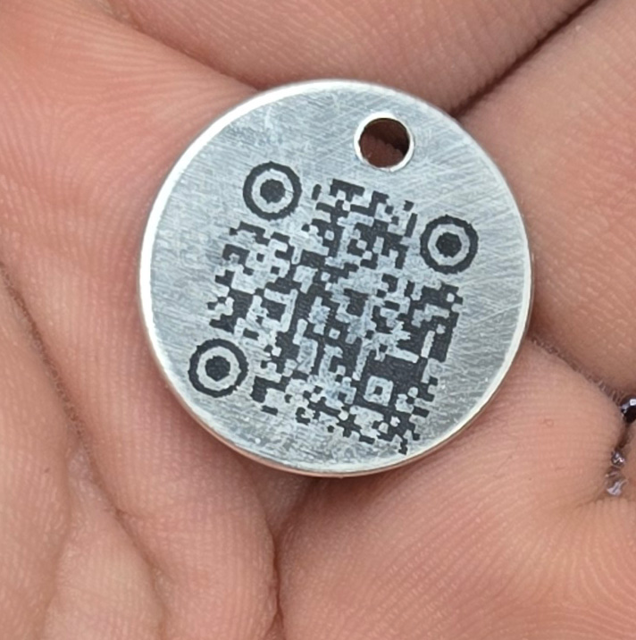 PetQR tag back side showing engraved QR code